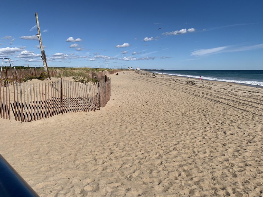 a sandy beach with a fence (MyCoast AI)