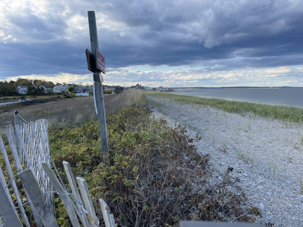 a wooden fence on a beach (MyCoast AI)