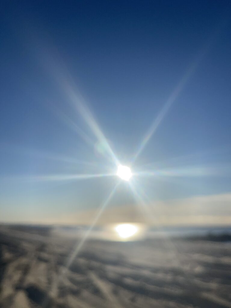a bright sun in the sky (MyCoast AI)