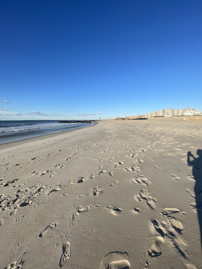 a beach with many footprints (MyCoast AI)
