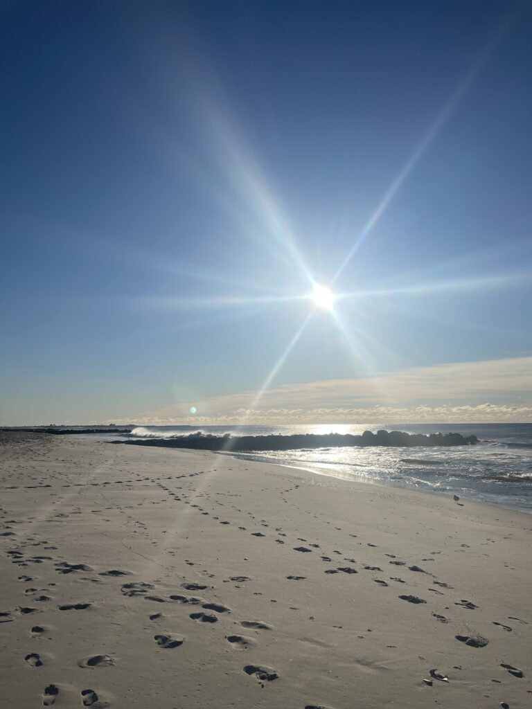 a beach with the sun in the sky (MyCoast AI)