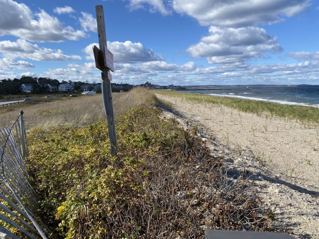 a fenced off area with a sign on it (MyCoast AI)
