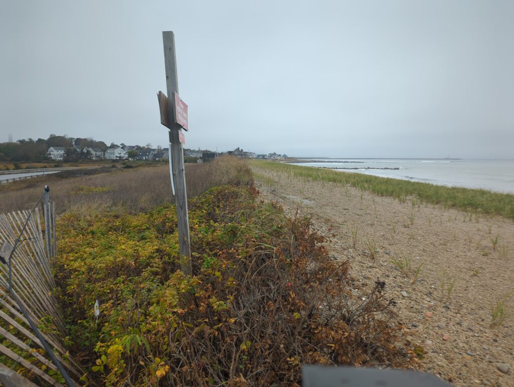 a sign on a beach (MyCoast AI)
