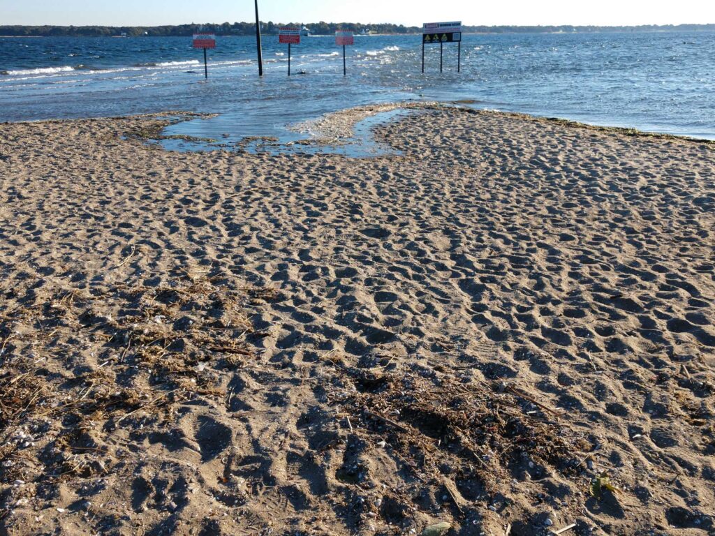 a sandy beach with signs (MyCoast AI)