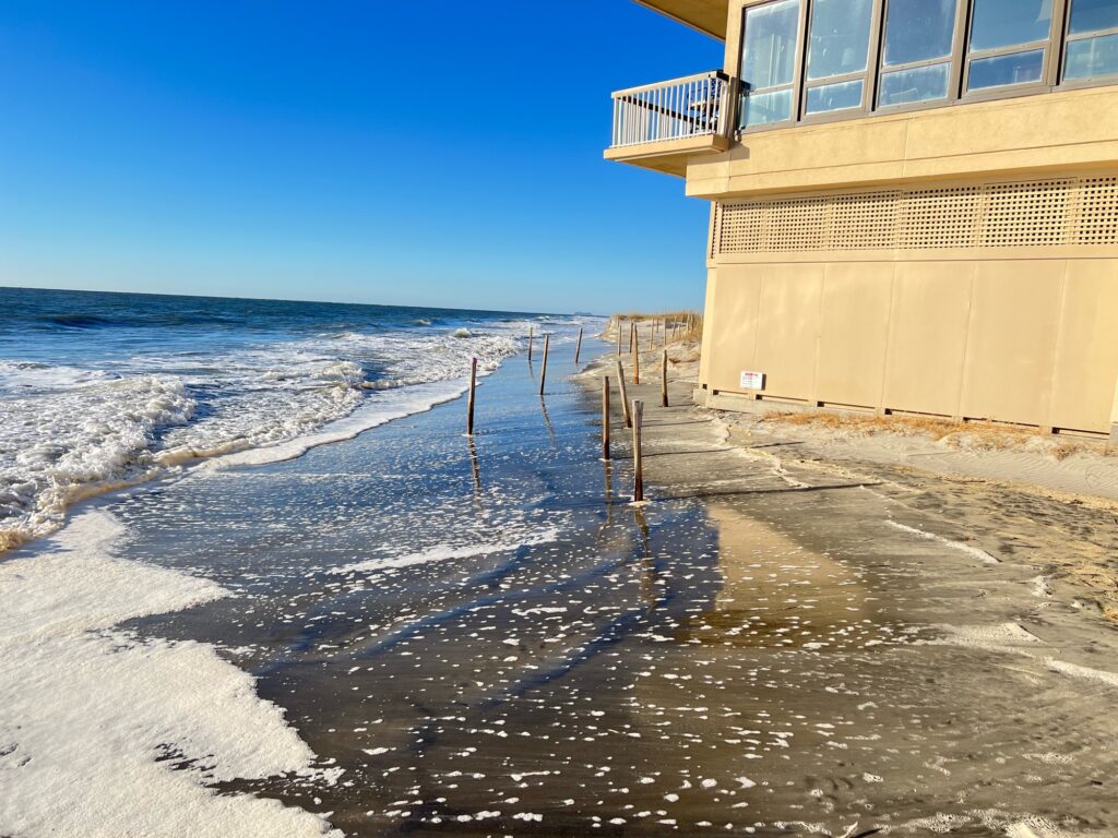 a building next to a beach (MyCoast AI)