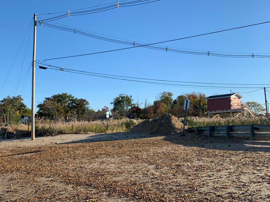 a dirt road with a pile of dirt on the side (MyCoast AI)