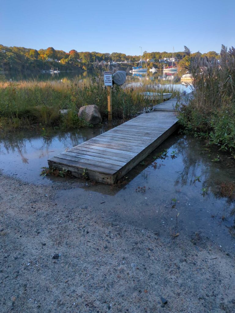 a wooden dock over a river (MyCoast AI)