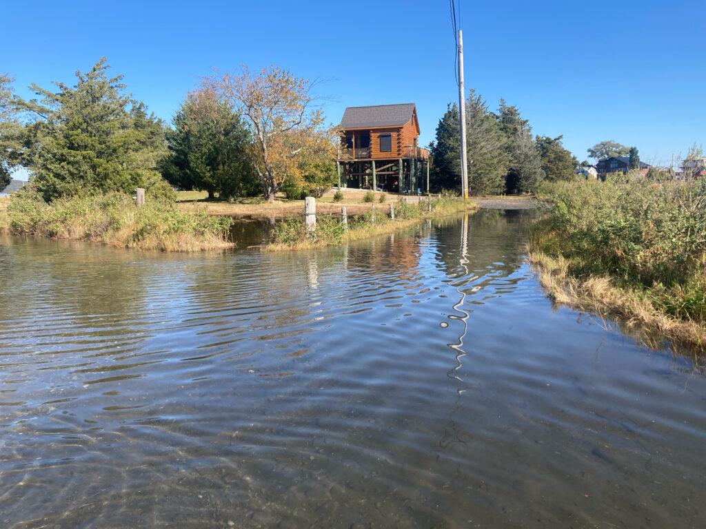 a body of water with a house in the background (MyCoast AI)