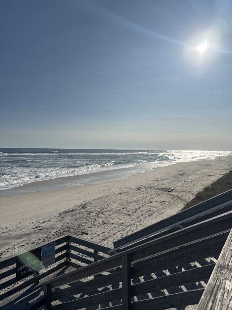 a beach with waves crashing on it (MyCoast AI)