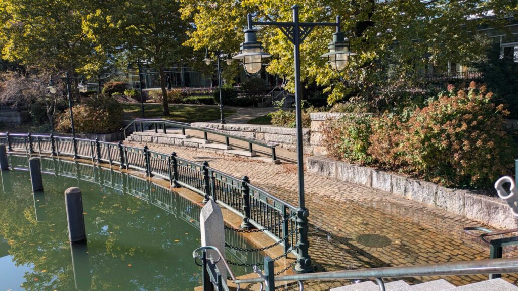 a pool with a lamp post and a lamp post by it (MyCoast AI)