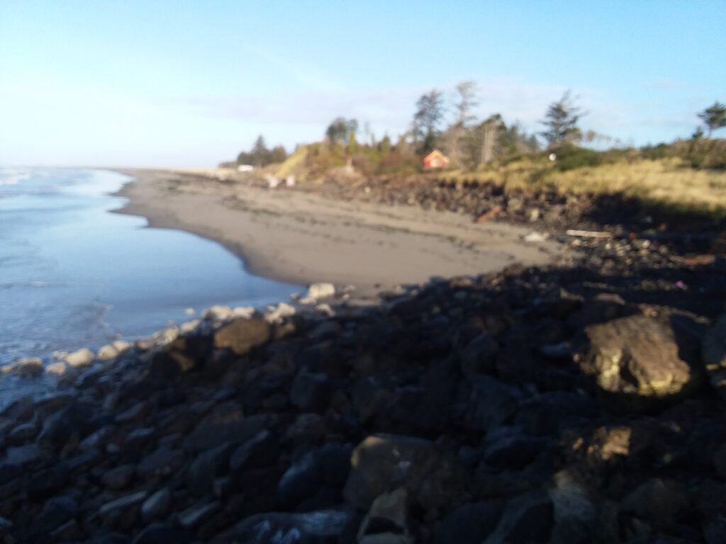 a rocky beach with a tent (MyCoast AI)