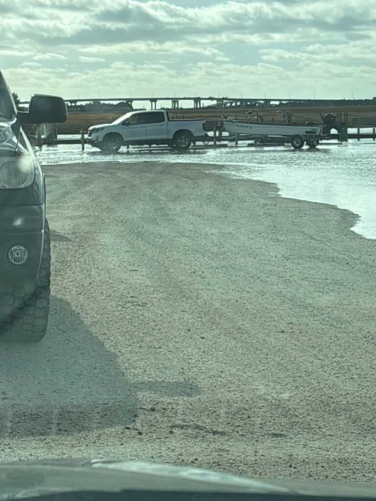 a truck parked on a beach (MyCoast AI)
