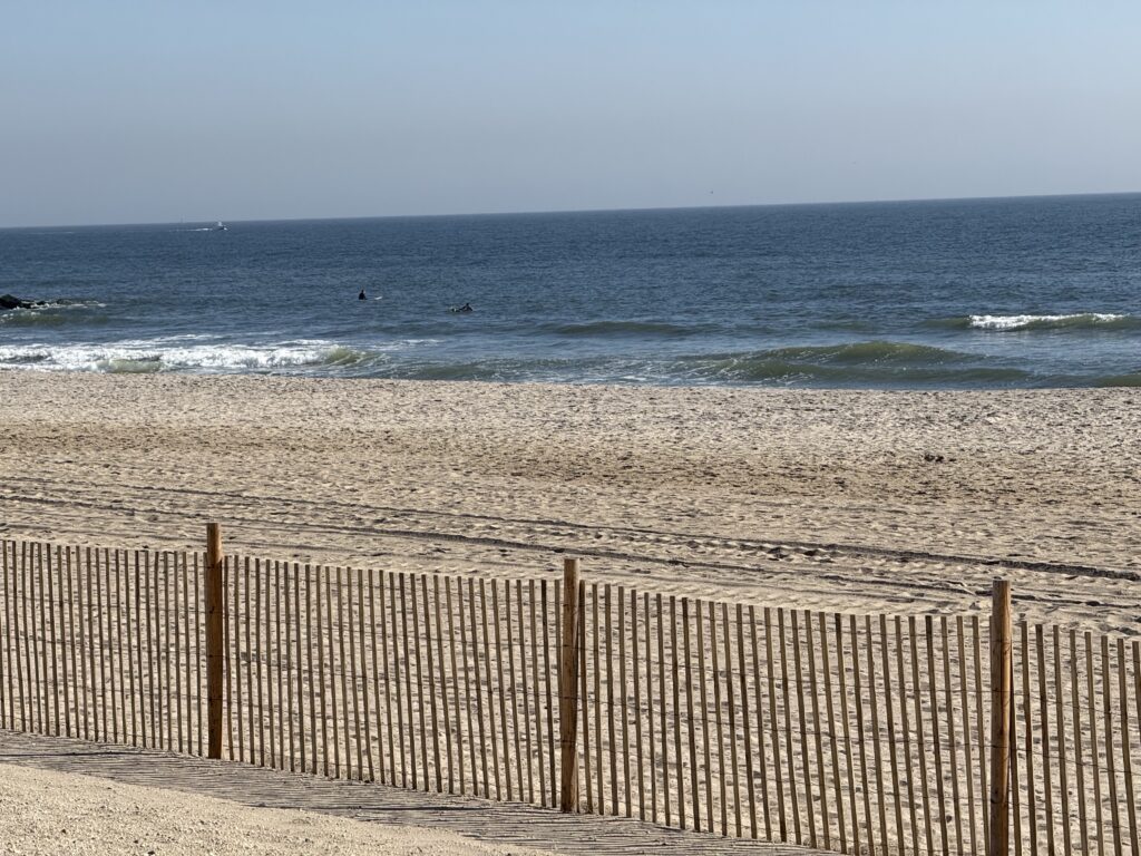a beach with waves crashing (MyCoast AI)