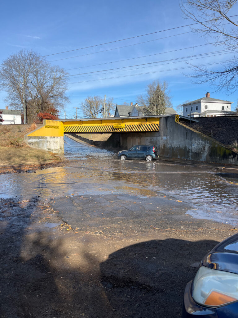 a car driving on a flooded road (MyCoast AI)