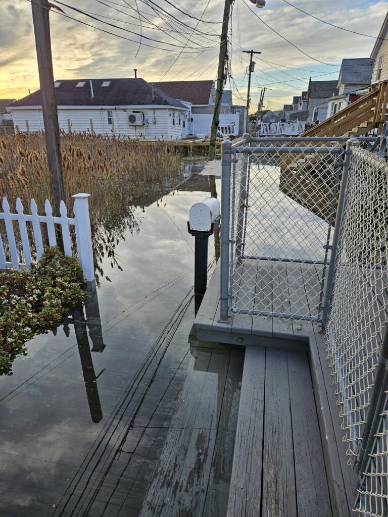 a wooden bridge with a metal fence (MyCoast AI)