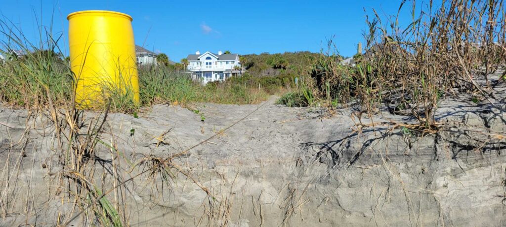 a yellow bucket on a beach (MyCoast AI)