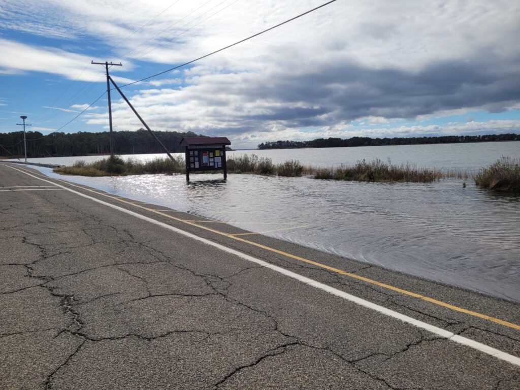 a flooded road with a sign (MyCoast AI)