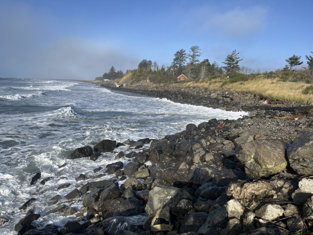 a rocky beach with waves crashing (MyCoast AI)