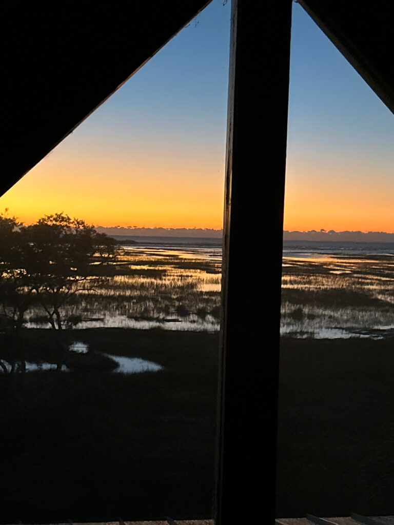 a view of a sunset through a window (MyCoast AI)