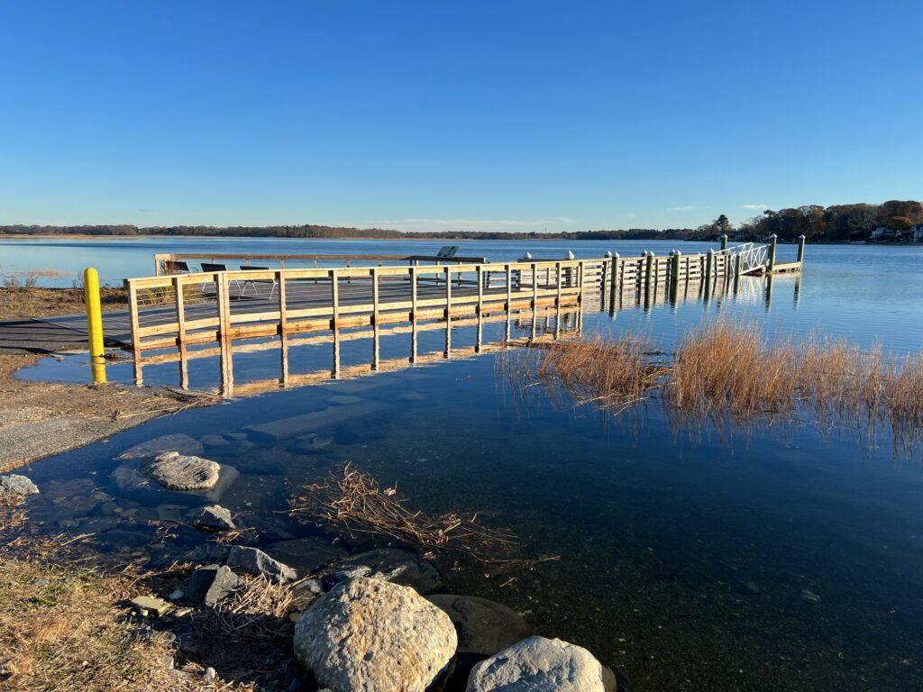 a wooden dock over a body of water (MyCoast AI)