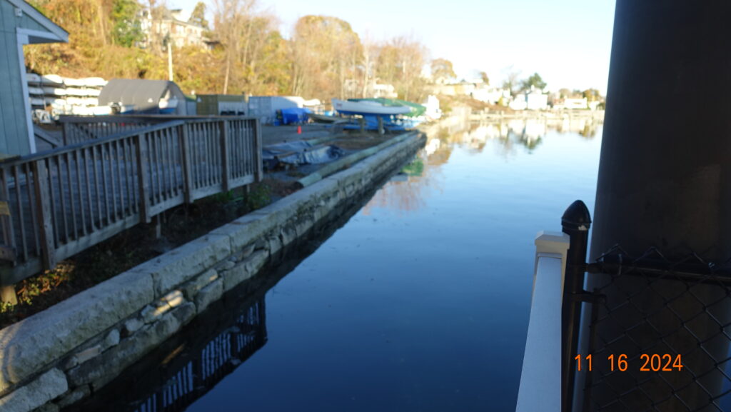 a body of water with a bridge and buildings along it (MyCoast AI)