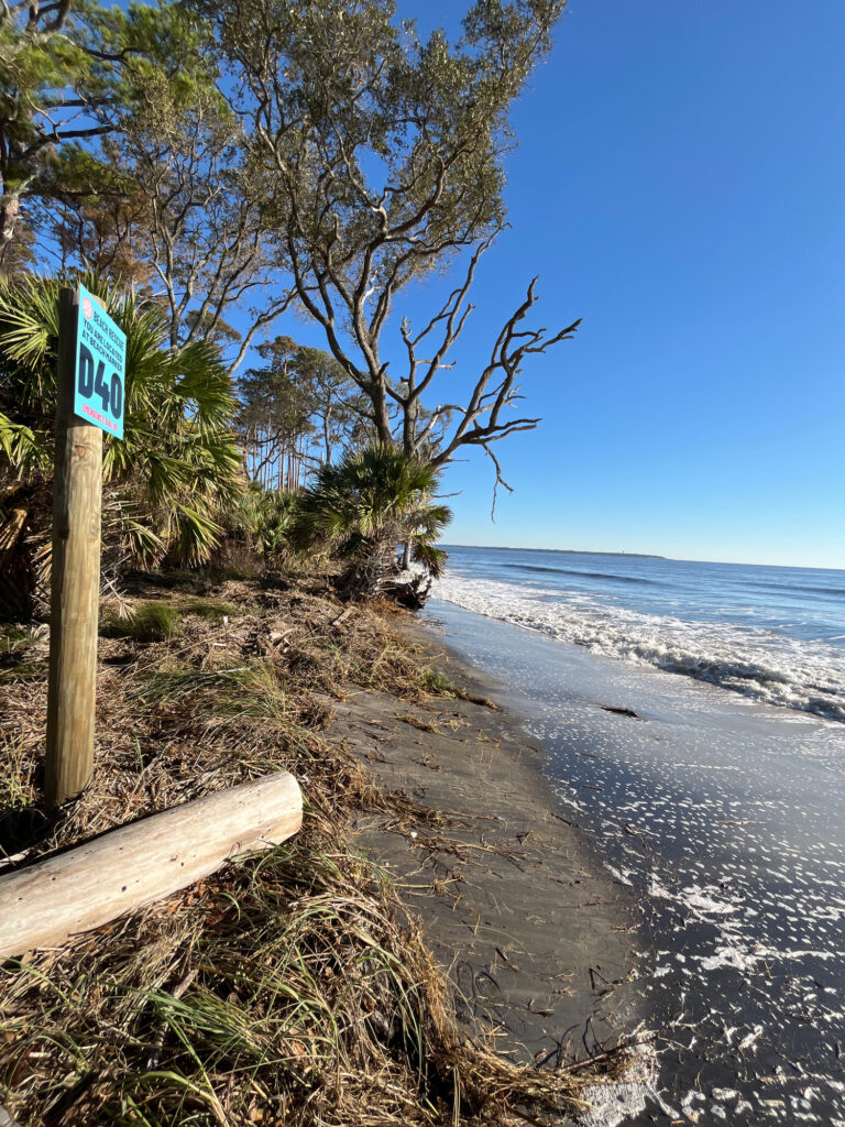 a beach with a sign (MyCoast AI)