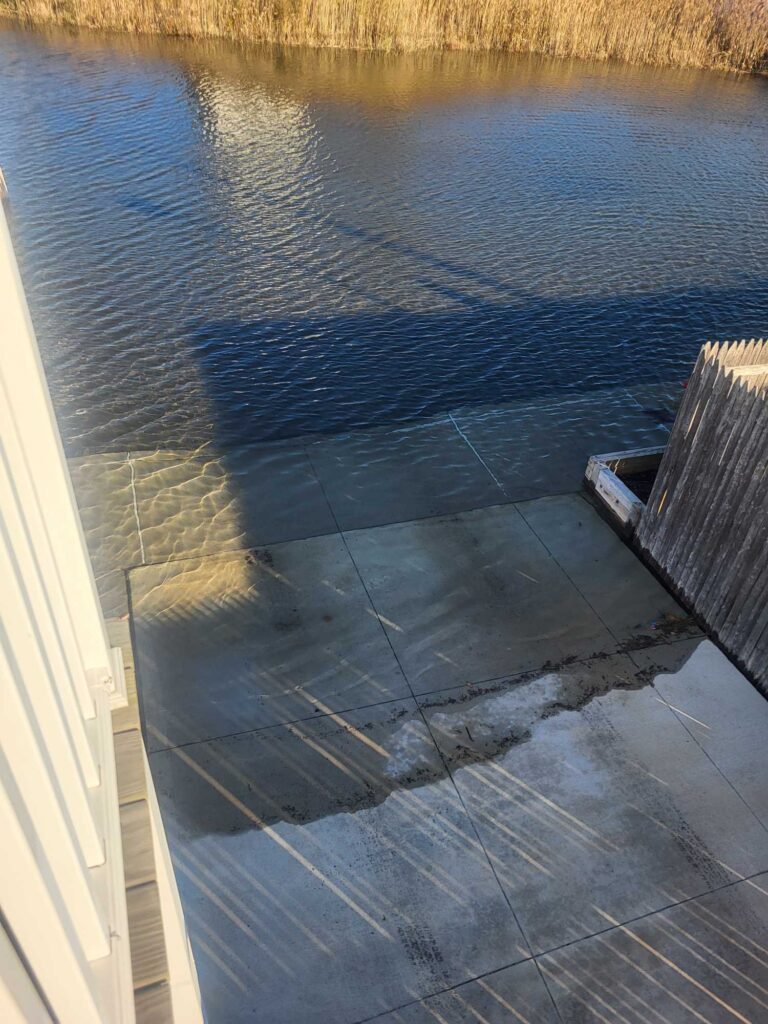 a wooden bench next to a body of water (MyCoast AI)