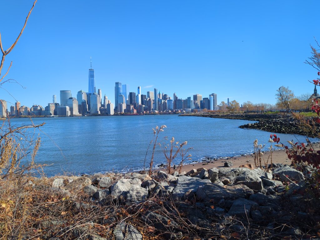 a city skyline across a body of water (MyCoast AI)
