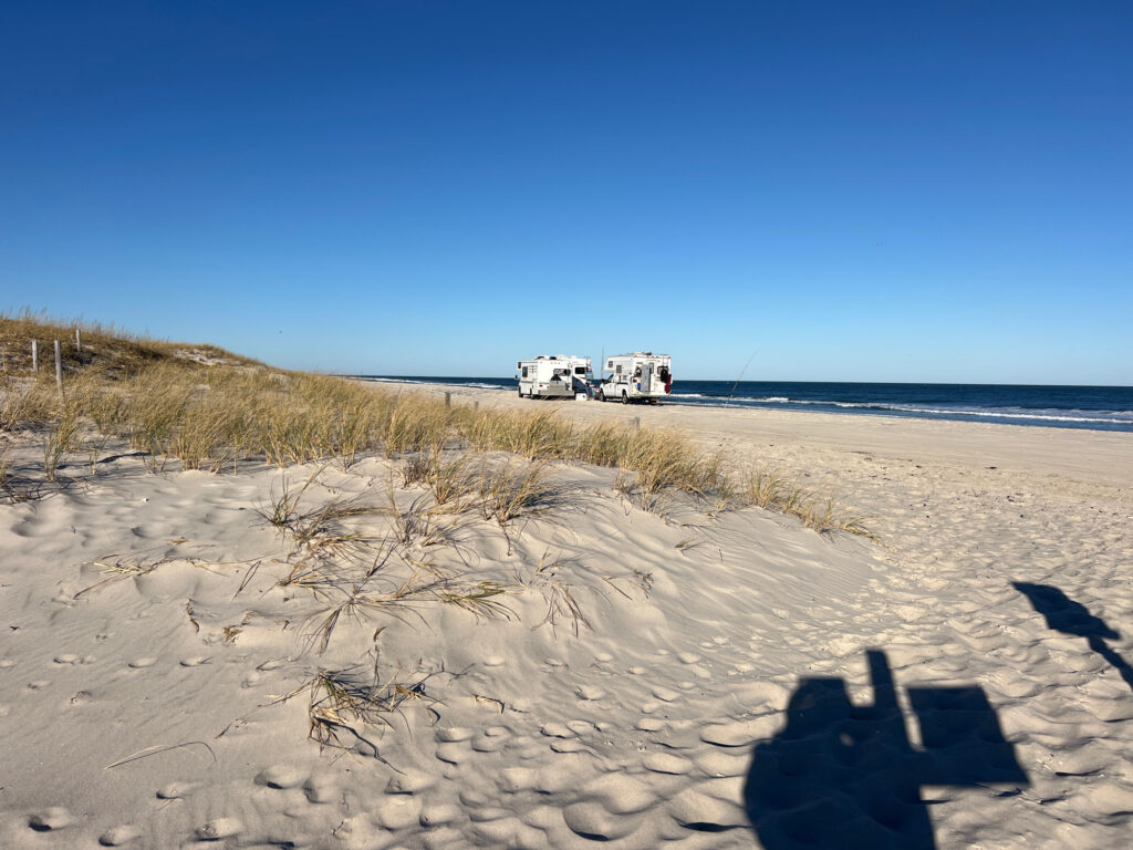a group of vehicles parked on a beach (MyCoast AI)