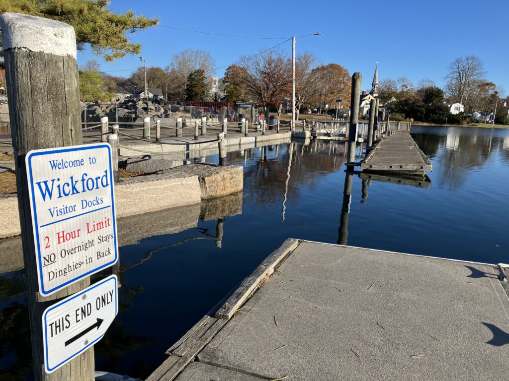 a body of water with a dock and signs on it (MyCoast AI)