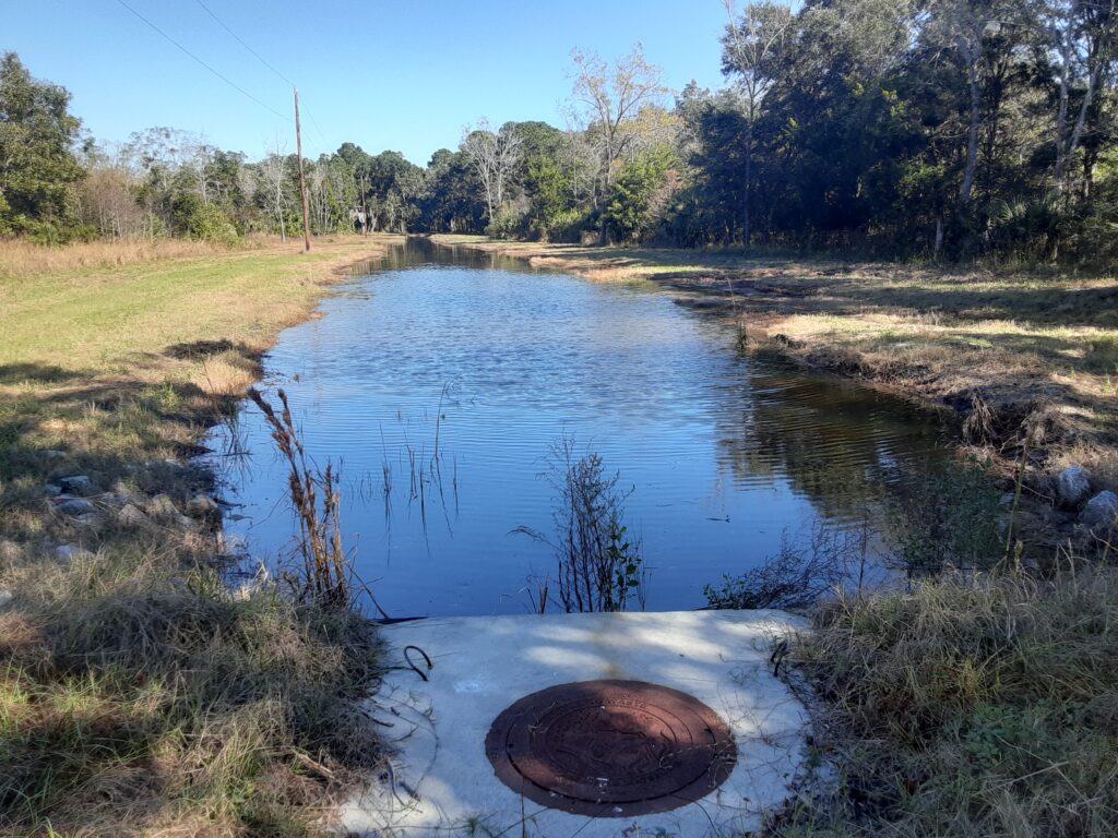 a small river with a tire in it (MyCoast AI)