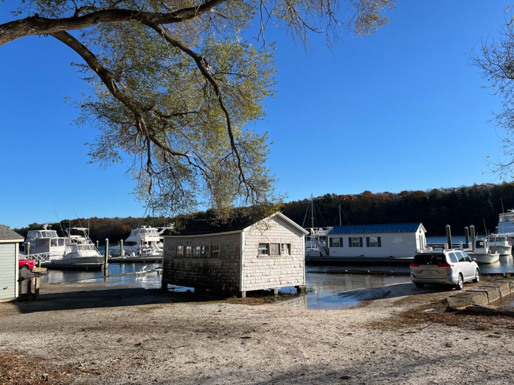 a group of boats parked on the shore of a lake (MyCoast AI)