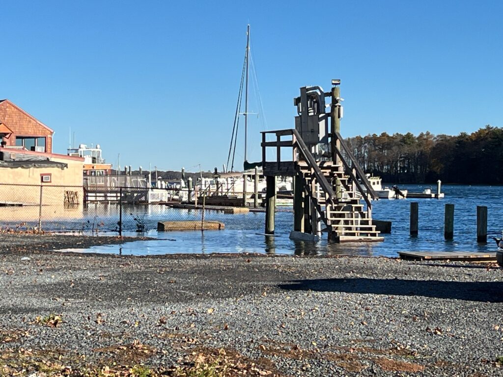 a dock with a boat in the water (MyCoast AI)