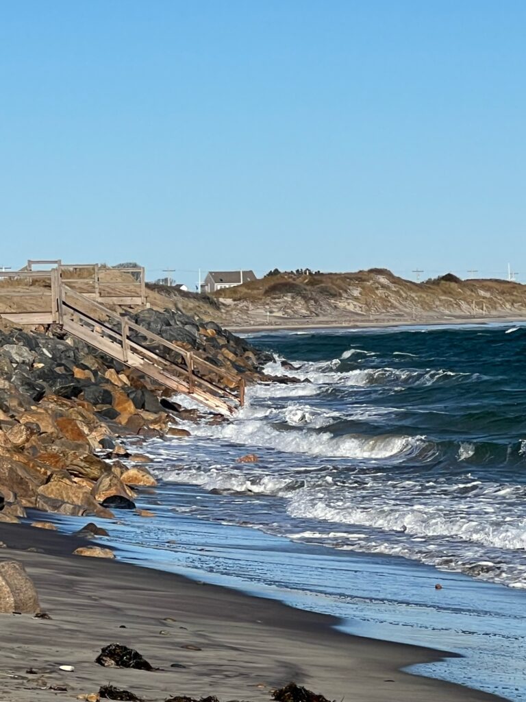a rocky beach with waves crashing on it (MyCoast AI)