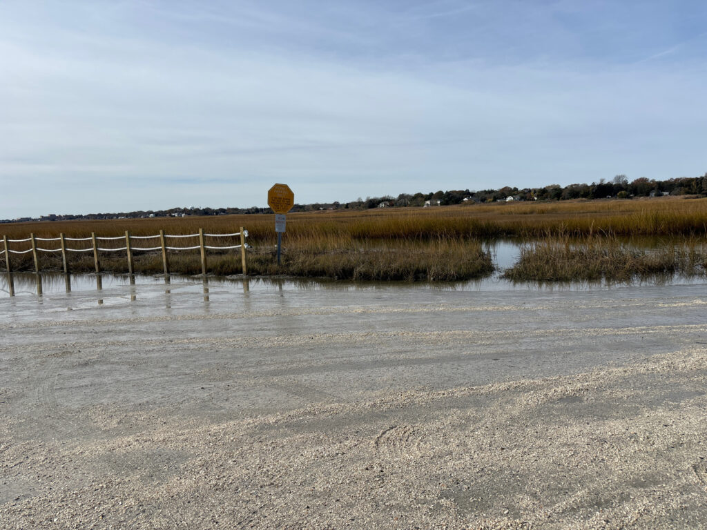 a body of water with a sign in it (MyCoast AI)