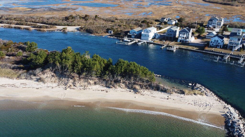 a group of houses on a beach (MyCoast AI)