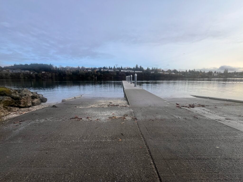a sidewalk next to a body of water (MyCoast AI)