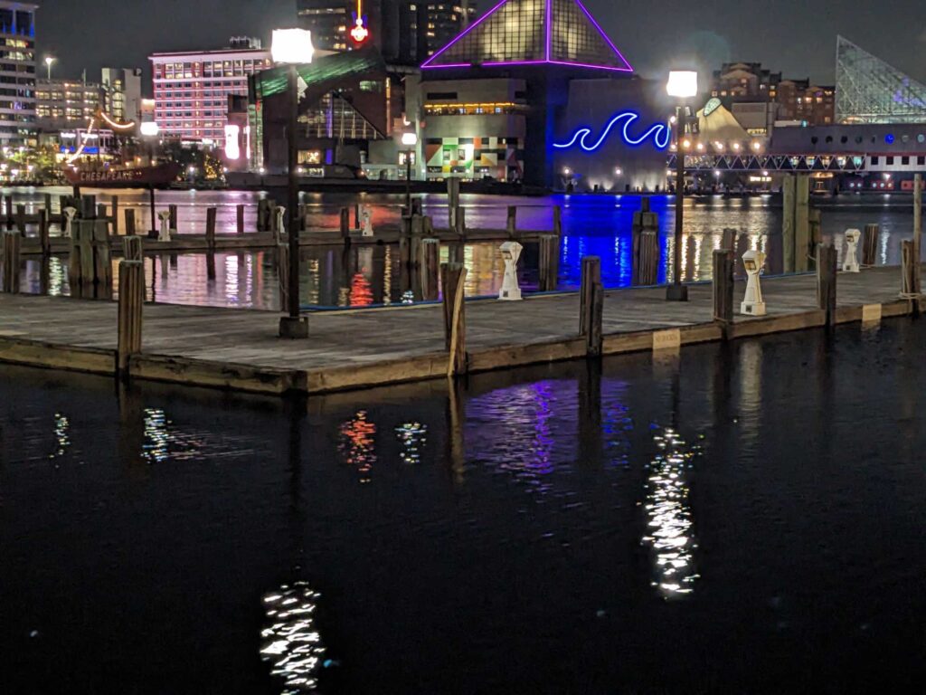 a body of water with buildings and lights in the background (MyCoast AI)