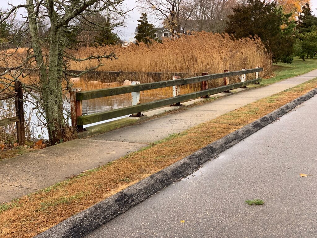 a wooden fence on a road (MyCoast AI)