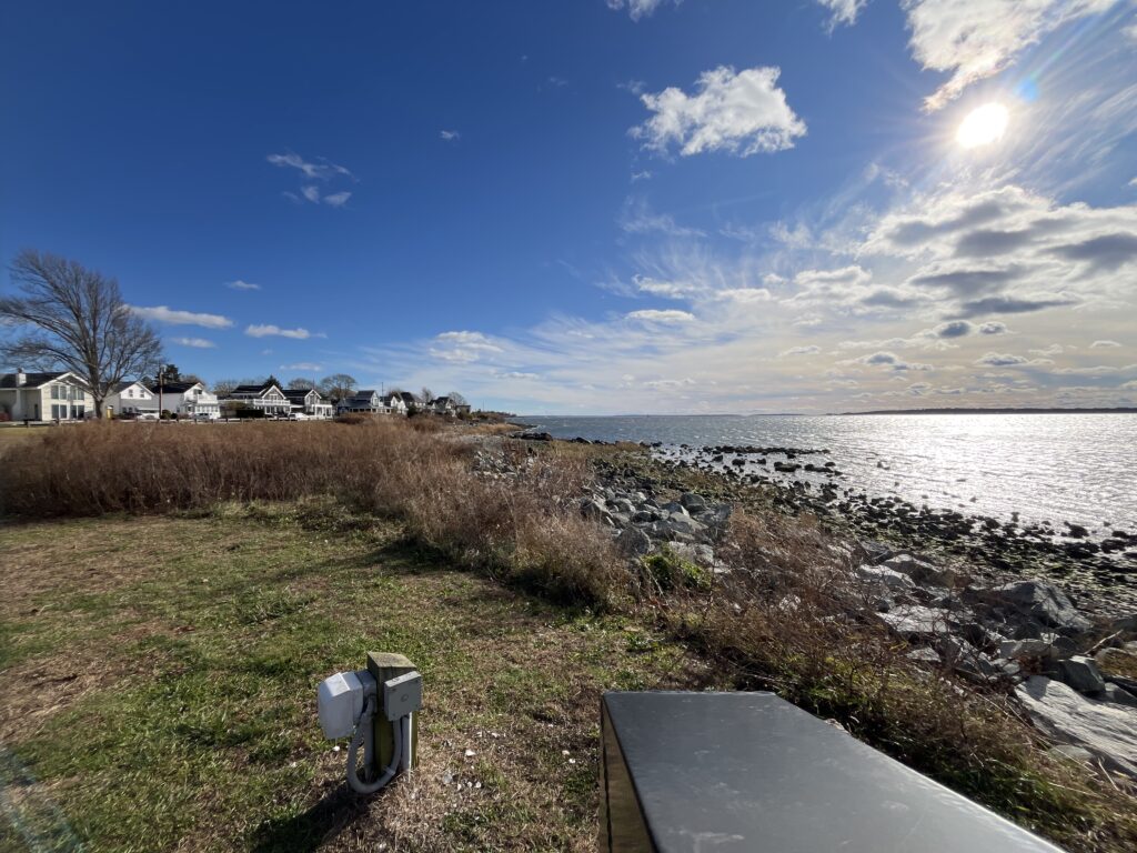 a view of a beach and houses (MyCoast AI)