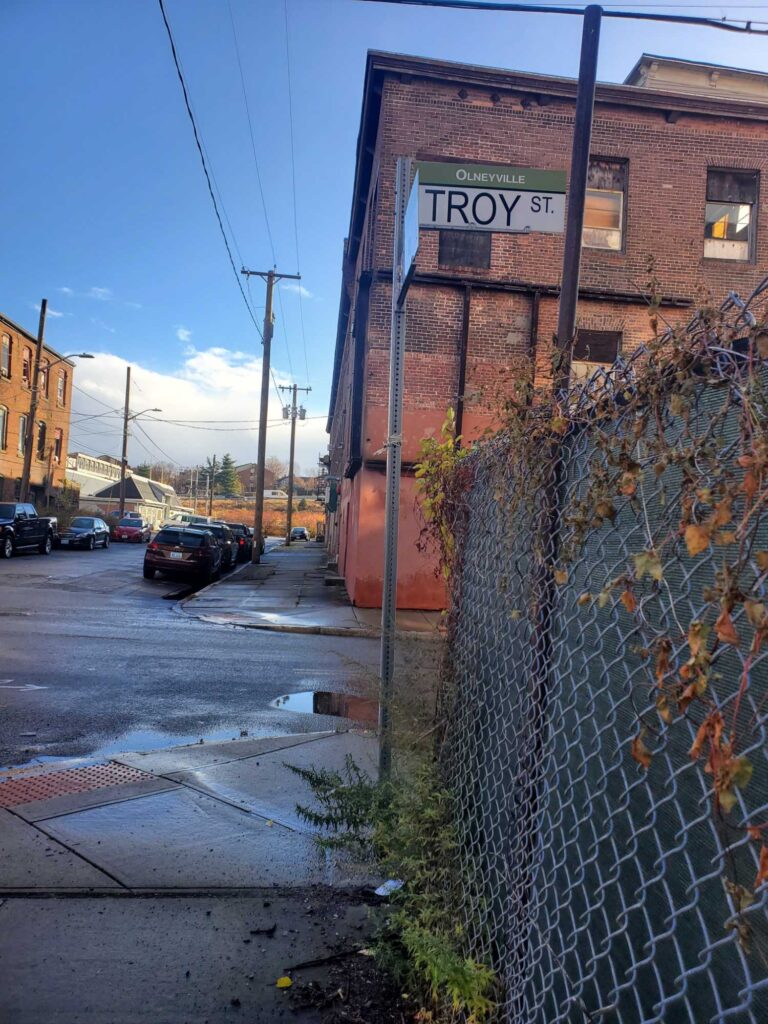 a brick building with a sign on it (MyCoast AI)