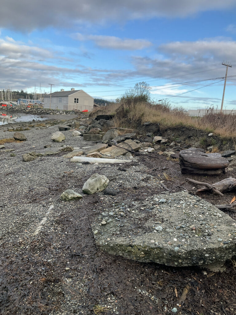 a rocky road with a building in the background (MyCoast AI)
