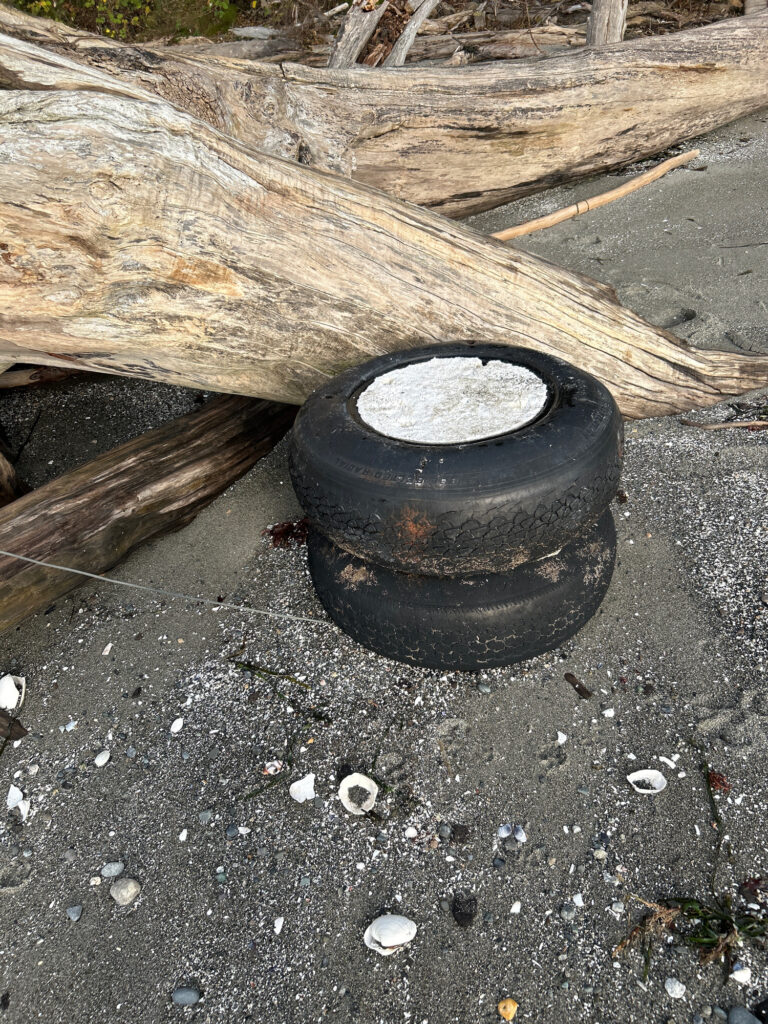 a black bucket on the ground (MyCoast AI)