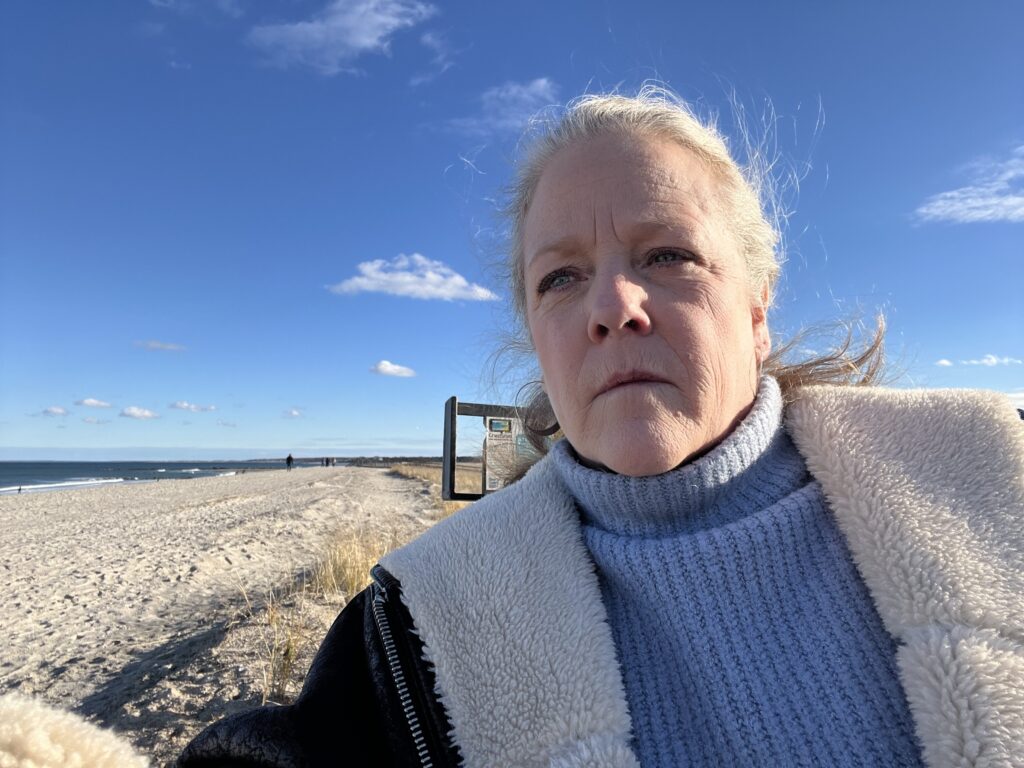 a man taking a selfie on a beach (MyCoast AI)