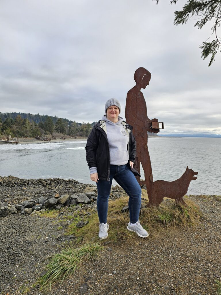 a person standing next to a statue (MyCoast AI)