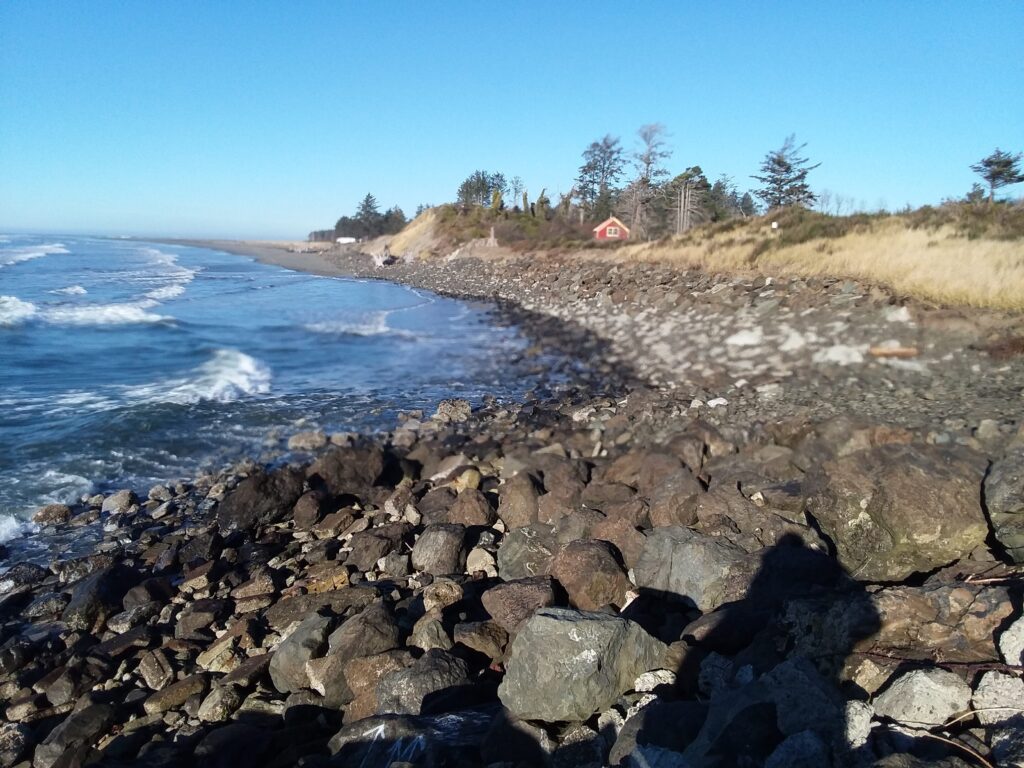 a rocky beach with waves crashing (MyCoast AI)