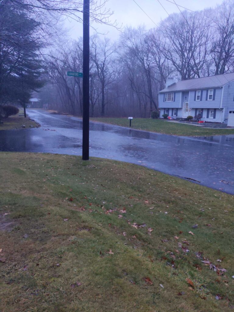 a flooded street with a house (MyCoast AI)