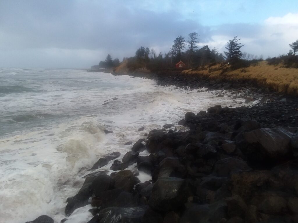 a rocky beach with waves crashing (MyCoast AI)