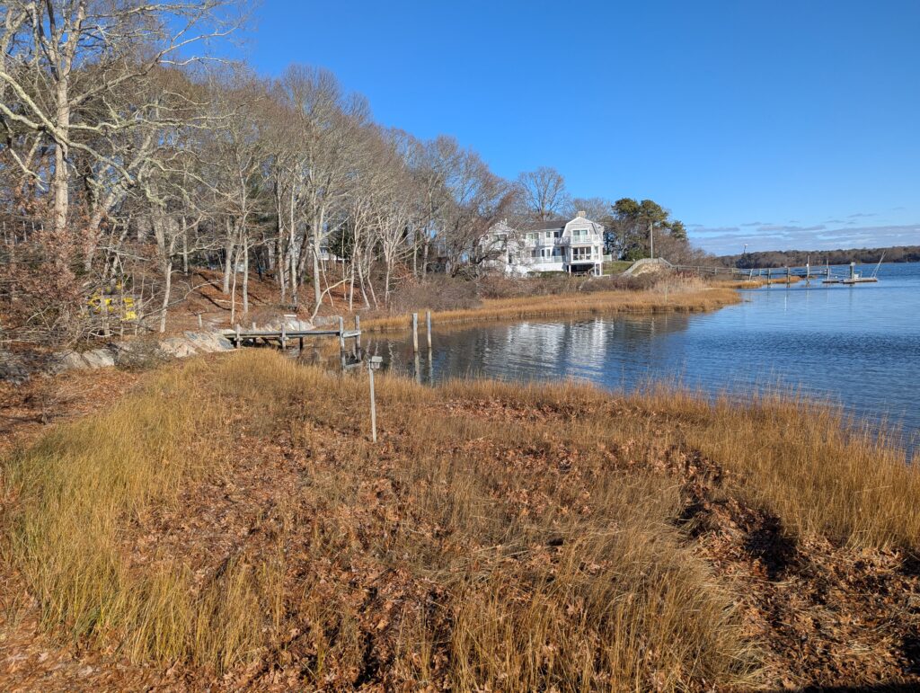 a house on a hill by a lake (MyCoast AI)
