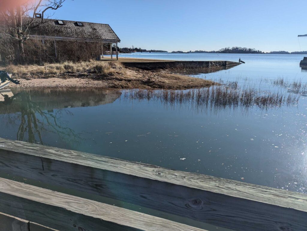 a body of water with a building in the background (MyCoast AI)